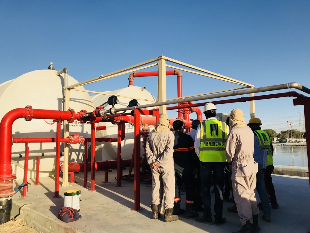 Fire protection system maintenance and safety inspection at an industrial facility.