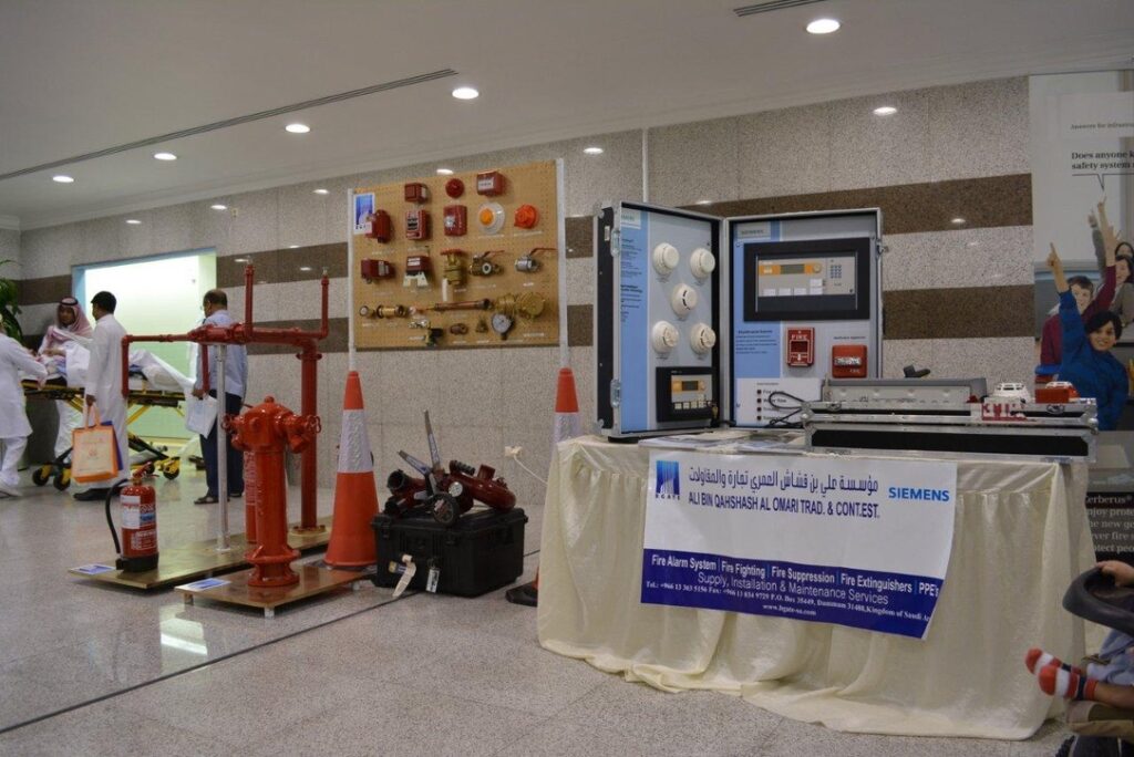 Fire protection products display with fire alarm panels, detectors, hydrants, and extinguishers.